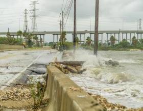 Water crashing over a road near Galveston Bay just outside of Houston Texas during Hurricane Harvey